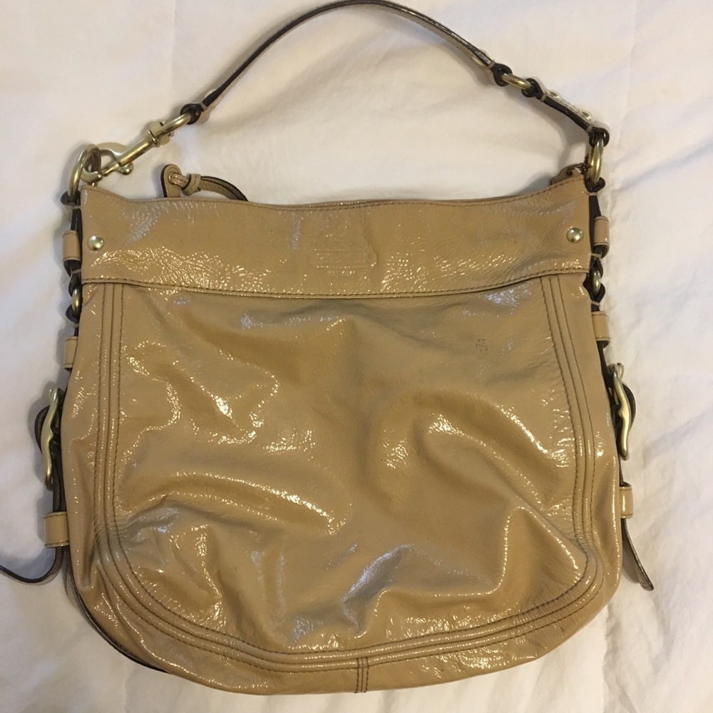 Tan COACH purse/bag.
